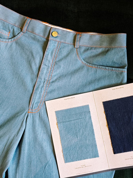Stylish Light Blue Denim Trousers with Classic Bronze Stitching